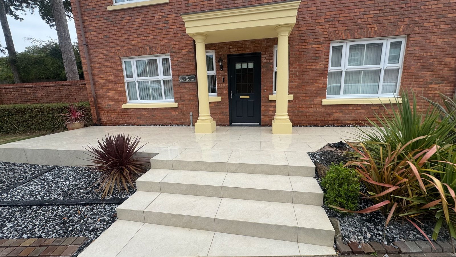 Front Porcelain Patio With Mitred Steps